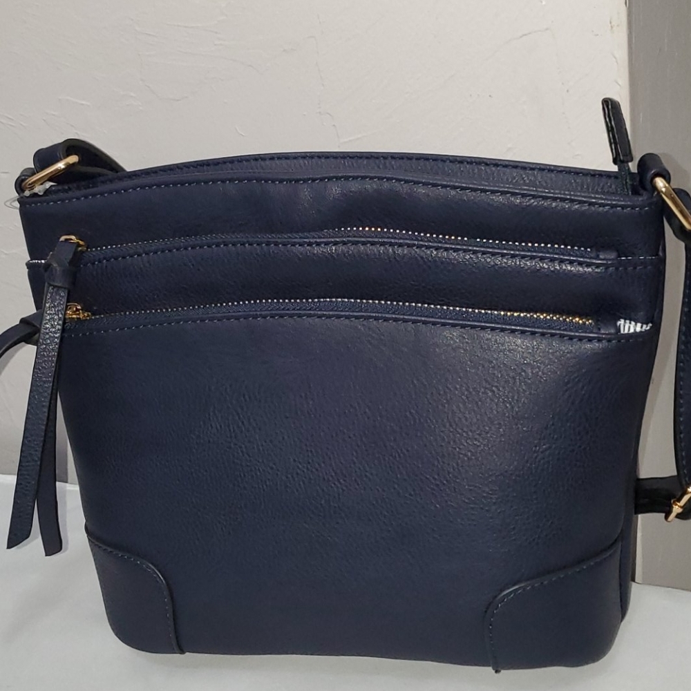 New with tags. Medium crossbody with lots of room.